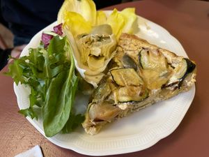 Quiche with endive and artichoke salad £10  at Café Petiole in London