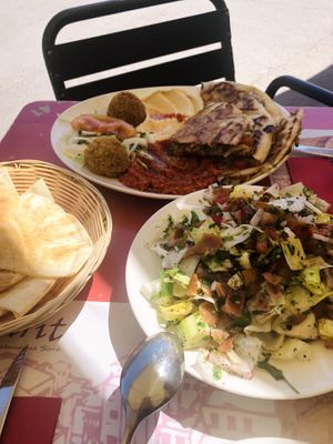 Arayes patata, hummus and mohamara combo. Fattuch salad.  at Ugarit  in Barcelona