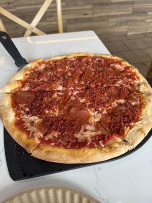 The vegan pizza with vegan bacon, vegan pepperoni, and vegan cheese    at Roman's Pizza House in Absecon