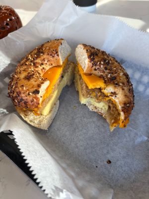 Bagel sandwich-had to take a bite, it looked so good! Just Egg + vegan sausage n cheese. Really hit the spot. Opens at 7 a.m. now for breakfast & coffee! at Roman's Pizza House in Absecon