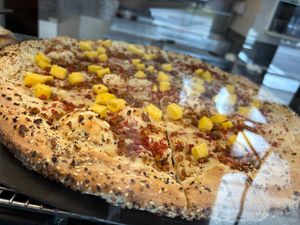 Mmm..breakfast pizza with egg, sausage & bacon crumbles. All vegan. Excellent choice. Love the everything seasoning on the crust. at Roman's Pizza House in Absecon