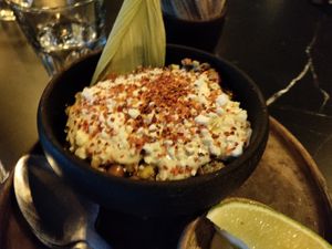 Esquites loaded with mayo and cheese at Luvina in Mexico City
