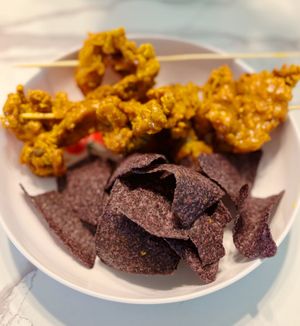 Fried Oyster Mushroom Skewers with Blue Chips at Big Belly Vegan in Sanford