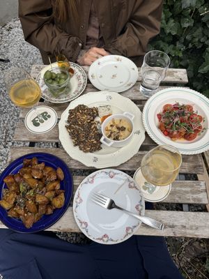 Olives, gremolata potates, tomato salad and FIR gras (and orange wine, amazing as well)  at Fir in Malmo