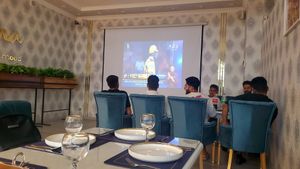 Watching criquet at Dostana Indian Restaurant in Samarkand