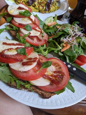 Tomato and vegan mozzarella on bread at V-Cake Cafe in Dresden