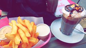 Fries with house made cheese sauce and creme fraiche + nougat hot chocolate with whipped cream. at Chaostheorie in Berlin