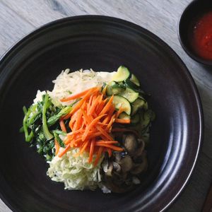 Vegan Bibimbap with 6 vegetable ingredients--carrots, spinach, mushrooms, cabbage, mung bean sprouts, and zucchini with Gochujang on the side. at Seoul Food in San Luis Obispo
