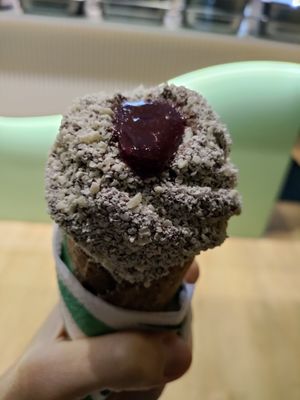 Cherry and white chocolate on chocolate soft serve at Fluo in Belgrade