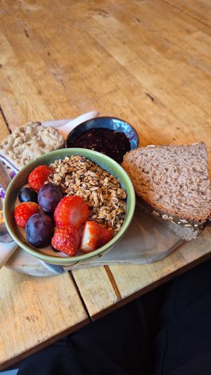 Vegan breakfast with: vegan yoghurt with granola, bread with jam, vegan scramble, tea or coffee and jus at Corazon Bakery in Amersfoort