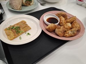 Not sure what the left dish is, something eggy? Dumplings right   at Loving Hut - Real Love in Seoul