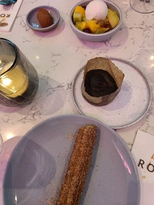 Churro, lava cake, fruits and one truffle at Rozey in The Hague