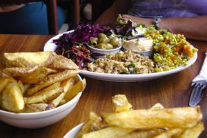 Delicious vegan salad platter with chips. at Roll for the Soul in Bristol