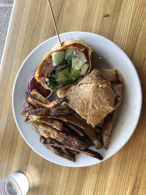 Very flavorful & filling vedg’head wrap chipotle tortilla w/crispy baked fries at The Cutting Board Bakery and Cafe in Mesa