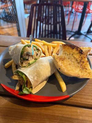 Imposter wrap with fries and garlic bread at Nando's in Portsmouth