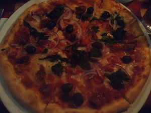 Vegan veggie supreme pizza with olives at Freddy's in Galway