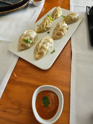 Vegan momos with spicy dipping sauce at Byanjan in Madrid