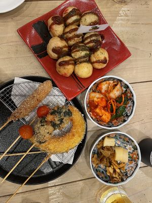 Takoyaki, kushikatsu (fried vegetable skewers), kimchi 3 kinds, and pickles  at Pivot BASE Cafe & Bar ＠Dotonbori in Osaka