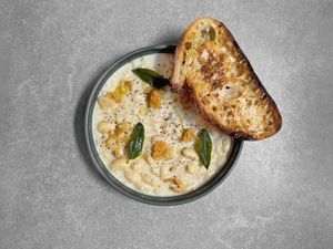 Butter beans & bread, sage, lemon zest, bean chips, olive oil, freshly ground pepper, maldon salt at Chef & Co in Prague