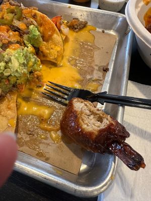 Mango habanero wings and nachos at Kind Burgers in San Antonio
