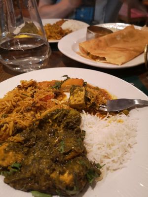 Masala dosas (background) tofu palak, mushroom rice at Sanskruti Restaurant in Manchester