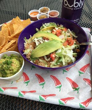 Vegetarian Crumble with a side of guacamole and chips. at El Camino Gourmet Tacos in Eagan