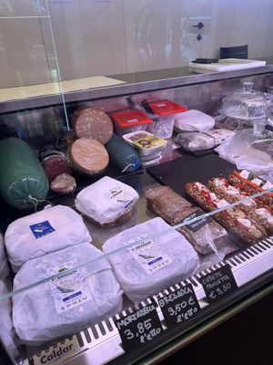 Vegan meats and cheese in case  at Fermaggio Bistrot & Store in Rome