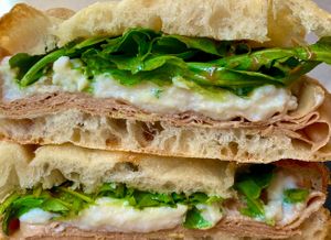 Pizza stuffed with rocket, veg burrata and mortadella, and pistachio cream at Fermaggio Bistrot & Store in Rome