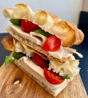 Caprese stuffed pizza with basil, fresh tomato and veg mozzarella at Fermaggio Bistrot & Store in Rome