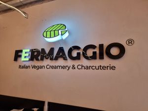 Fermaggio logo on wall at Fermaggio Bistrot & Store in Rome