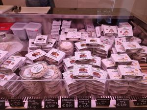 Counter full of cheeses at Fermaggio Bistrot & Store in Rome