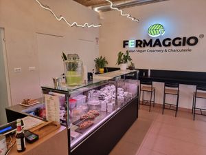 Inside , counter and some seating area at Fermaggio Bistrot & Store in Rome