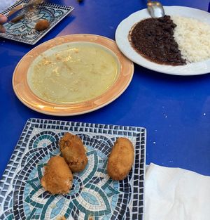 Yucca in garlic (all gone!), black beans and rice (half portion) and croquettes (most already eaten!)  at Habanita in Sevilla