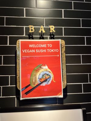 Small restaurant sign inside at the top of the staircase   at Vegan Sushi Tokyo in Tokyo