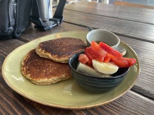 Pancakes with fruit and maple syrup   at Emilia Brunch & Cocktails in Guimaraes