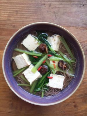 Red Rice Noodle in Vegetable Broth, spring sprouts, fresh tofu, mushroom. at Zenith in Hanoi