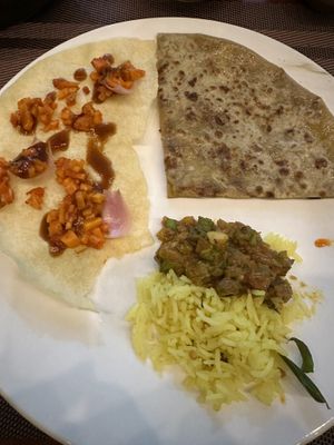 Top left: pickled radish, shallot, and a vegan sauce. Top right: Aloo Paratha (vegan), also Lemon Rice!  at Kerala Palace Authentic Indian Restaurant in Nha Trang