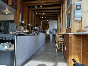 Many places to sit. Books to read for adults and toys for kidss  at Brewshot - Liberty Harbor in Jersey City