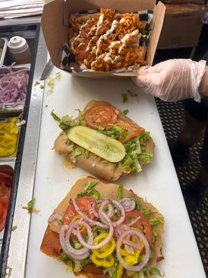 Assembly line of sandwiches and salads at Providence Vegan Deli in Providence