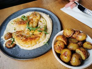 Cauliflower steak and potatoes at Food For Fit  in Sliema