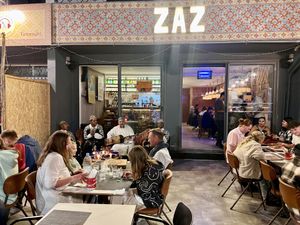 Exterior of restaurant with musicians playing   at ZAZ  in Tamraght