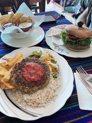 Set meal main - lentil patty with rice, fries & salad - tasty & filling. “Bolivian Burger” and side of fries.  at Charlis'nack in Copacabana