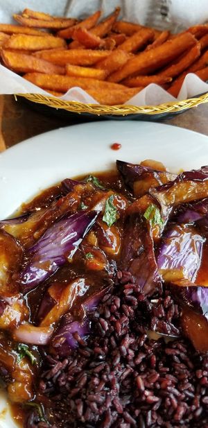 Eggplant, black rice. Sweet potato fries at Loving Hut in Sandy Springs