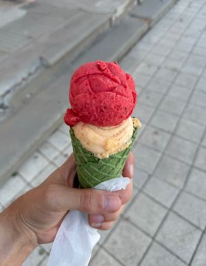 Sour cherry apricot ice cream in a green cone  at G&S Eiswelt in Sassnitz