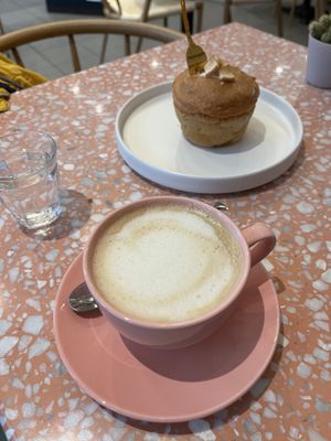 Oat milk coffee and breakfast muffin    at Cafe Good in Munich