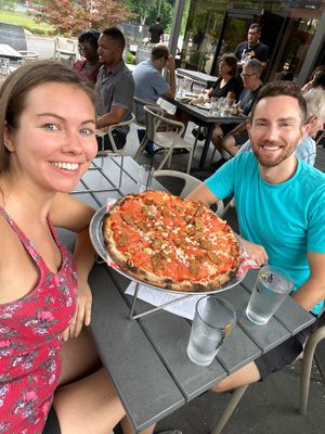 Enjoying a big vegan pizza in outdoor seating at Da Legna at Nolo in New Haven