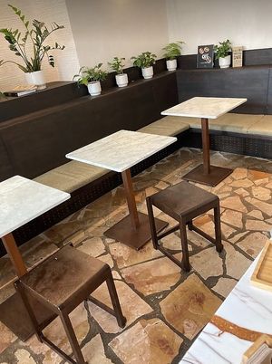 Interior seating at ARAKU COFFEE in Paris