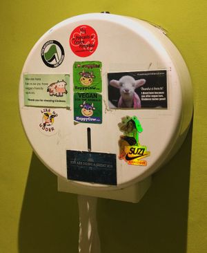 The cutest vegan stickers in the bathroom 🐷  at Le Potager du Marais - Saint Paul in Paris