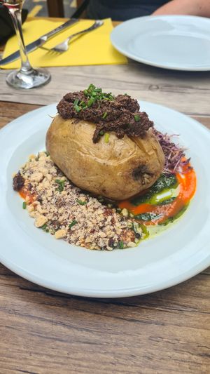 Entrée: roasted potato, with nuts, sprouted grains, pesto sauce and olive tapenade. at Le Potager du Marais - Saint Paul in Paris