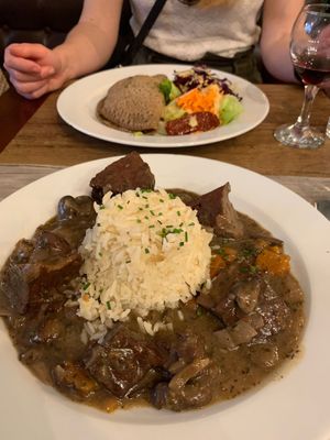 Main dishes. Seitan bourguignon near, spring onion crepe far  at Le Potager du Marais - Saint Paul in Paris